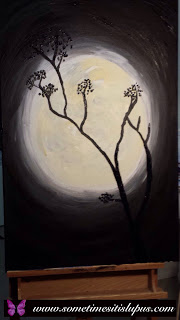 Painting of tree silhouetted against the full moon.